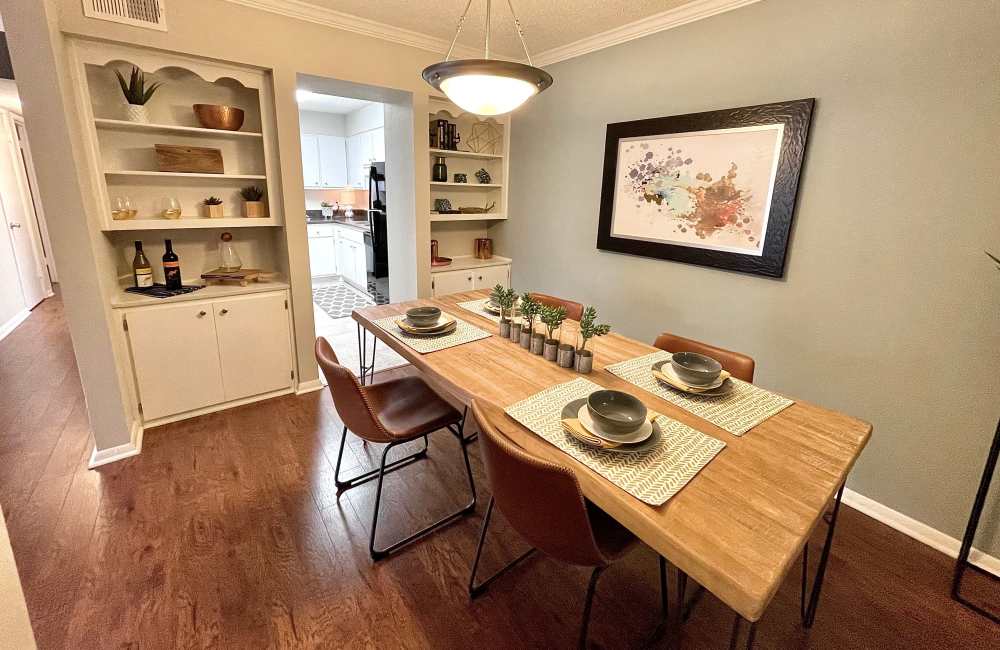 Dining room with built-in bookshelves at The Abbey at Regent's Walk in Homewood, Alabama