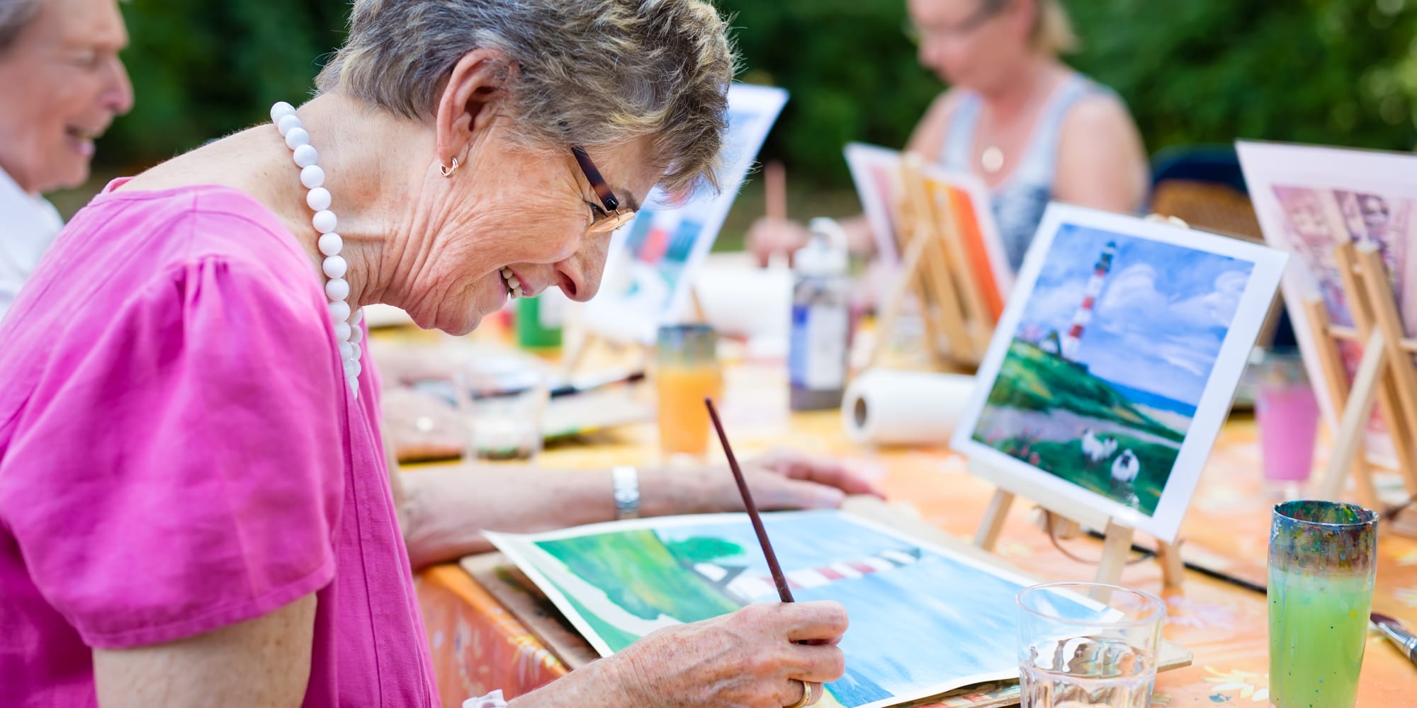 Resident working on a painting at Prestonwood Court in Plano, Texas