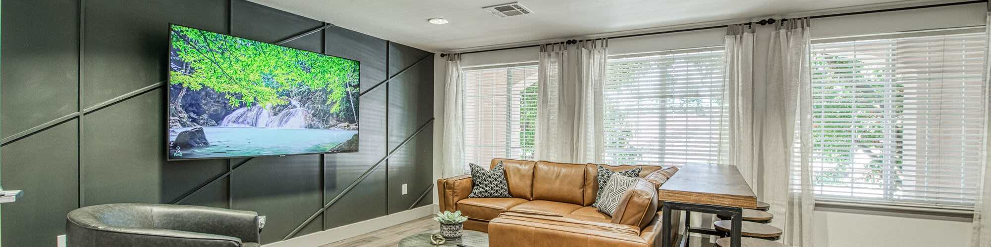 Clubhouse with lounge chairs and sofas at Photo Gallery | Westwood Bluffs in Fresno, California