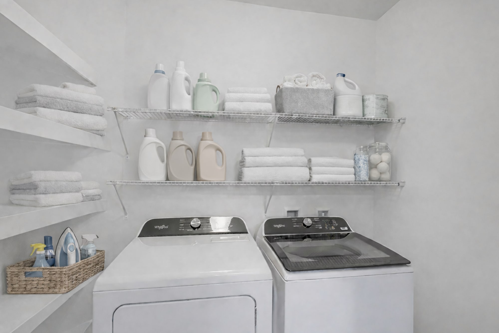 Carillon Apartments in Nashville, TN laundry room with in-home full size washer and dryer, built-in shelving, and wire storage racks