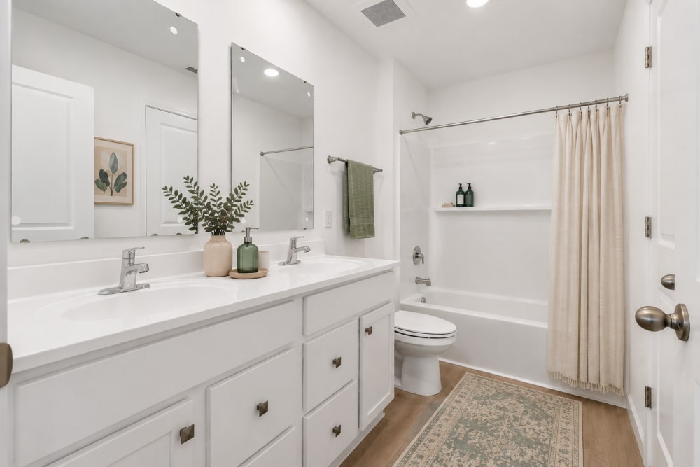 Bright, open bathroom with dual sinks at Brixin Sonora in Fort Wayne, Indiana