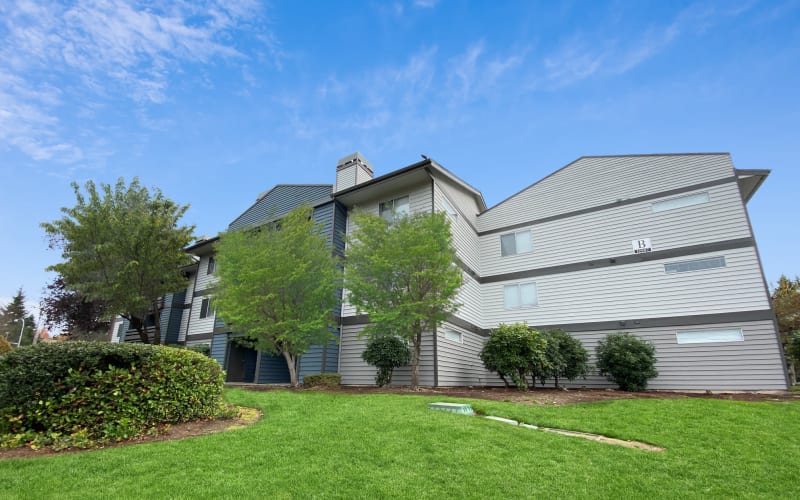 Property Exterior Building with Open Grass Area at Latitude Apartments in Everett, Washington