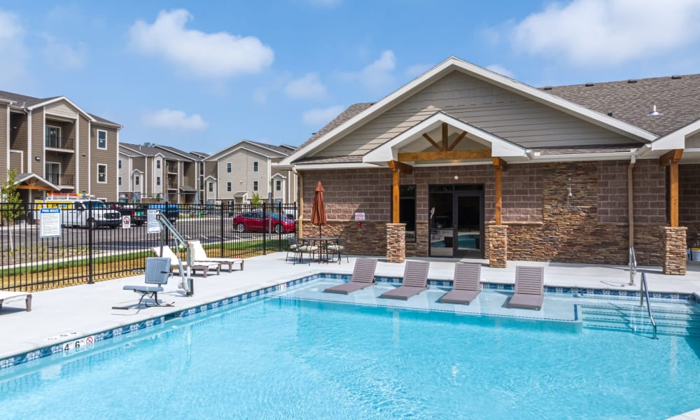 Apartment complex with community inground pool at Forest Ridge Villas in Kansas City, Missouri