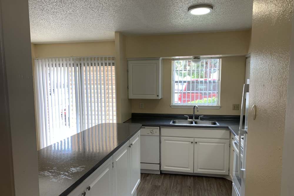 Apartment kitchen with modern appliances at Sagewood in El Paso, Texas