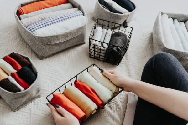 Resident folding laundry at River Pointe in Bethlehem, Pennsylvania