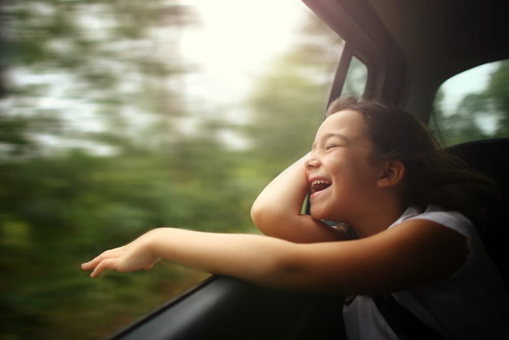 Child driving through park nearby at Sorrel Phillips Creek Ranch in Frisco, Texas