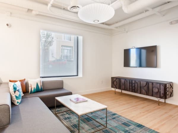 Modern decor in the open-concept living area of a model home at K Street Flats Apartment Homes in Berkeley, California