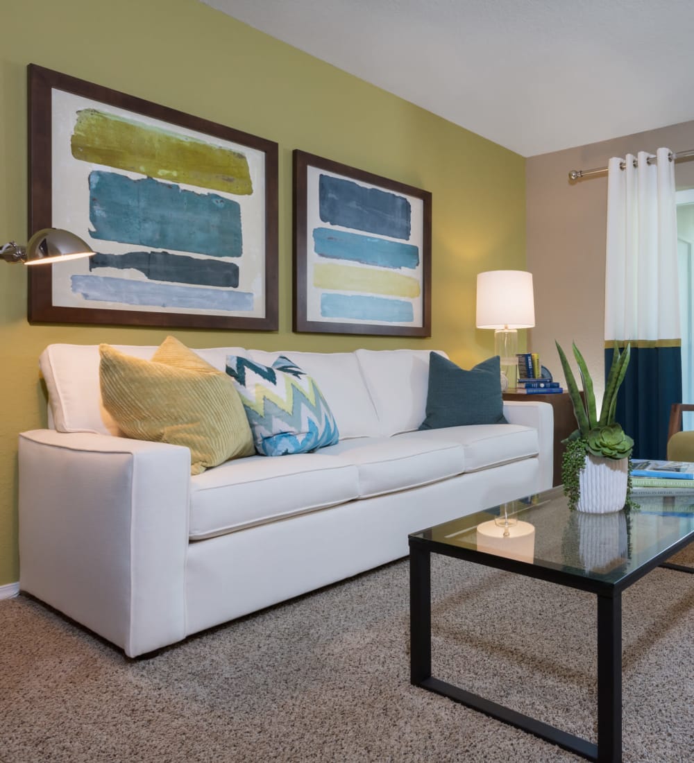 Well-decorated living area with an accent wall in a model home at Timbers at Tualatin in Tualatin, Oregon