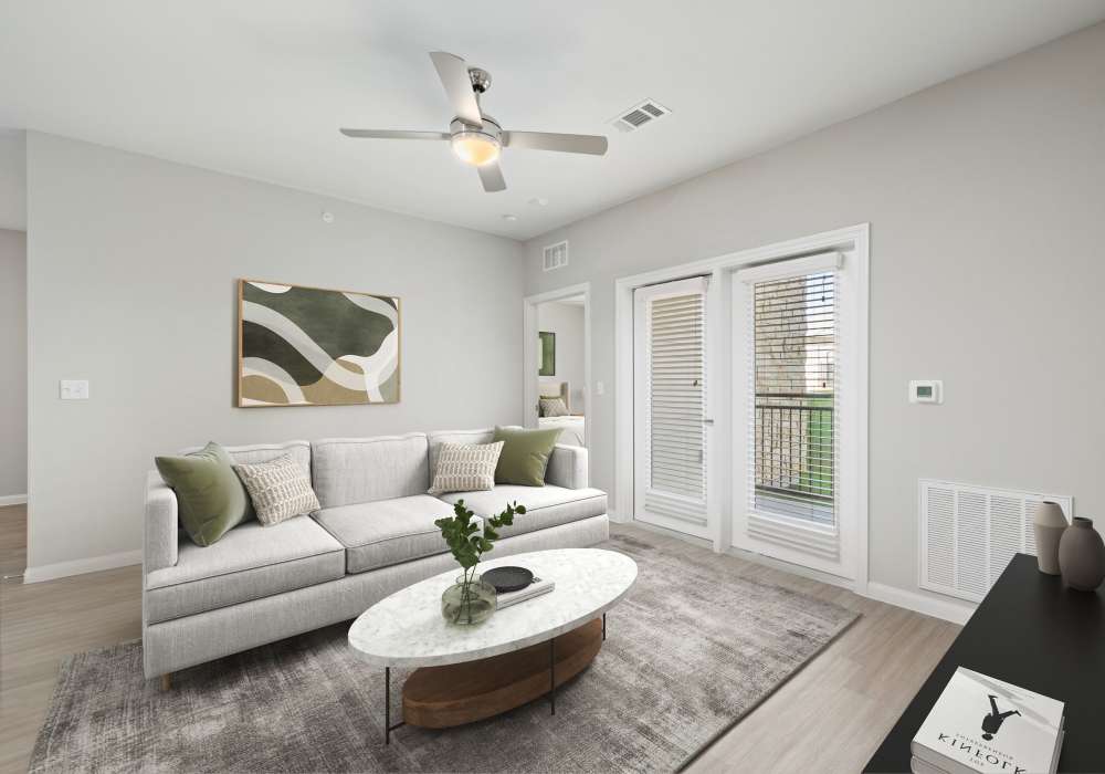 Living room with an elegant neutral color palette at Preserve at Gresham Lake in Raleigh, North Carolina