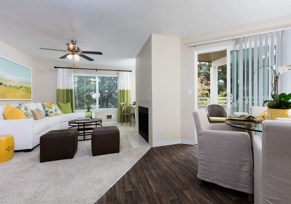 Model living room with carpet and hardwood floors at Skyline at Murrayhill in Beaverton, Oregon