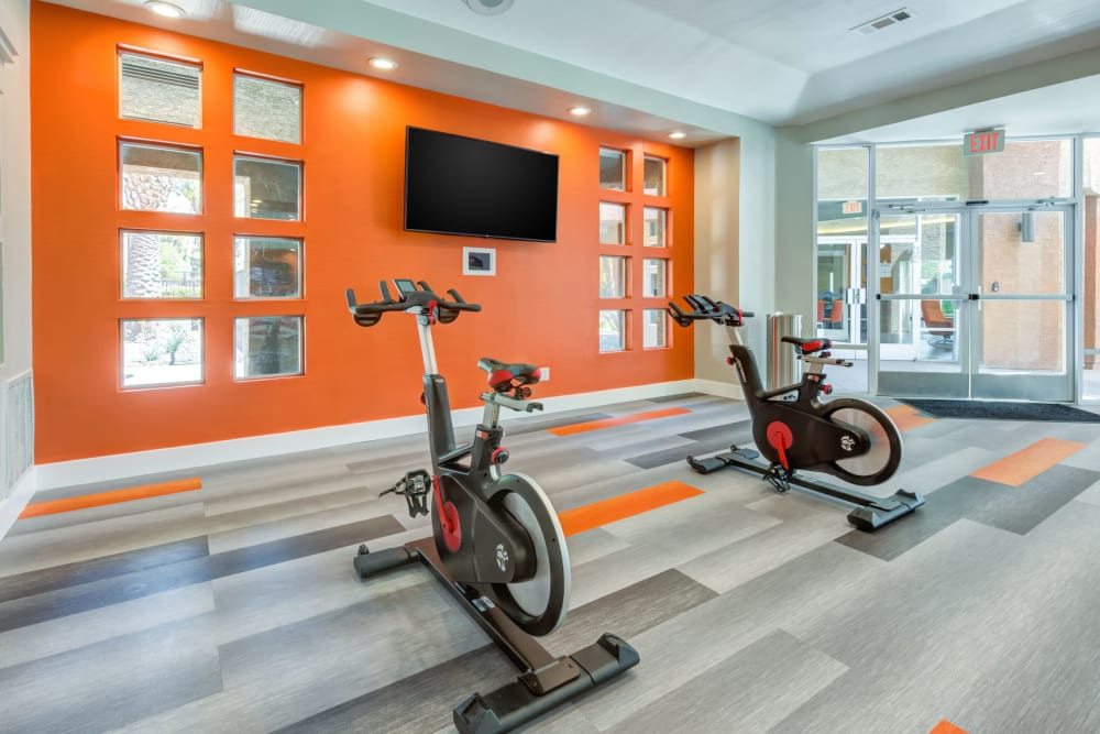 Fitness center with plenty of individual workout stations at Tuscany Village Apartments in Ontario, California