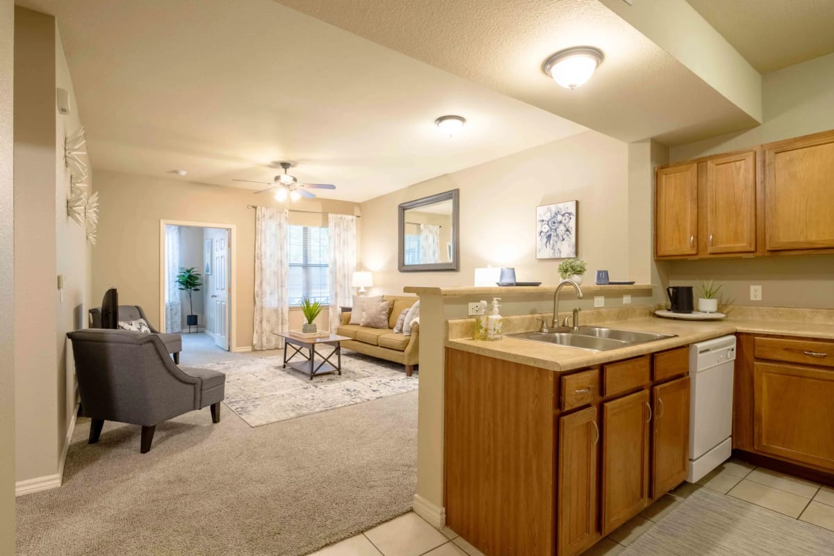 Apartment kitchen and living room at Parc At Rogers in Rogers, Arkansas
