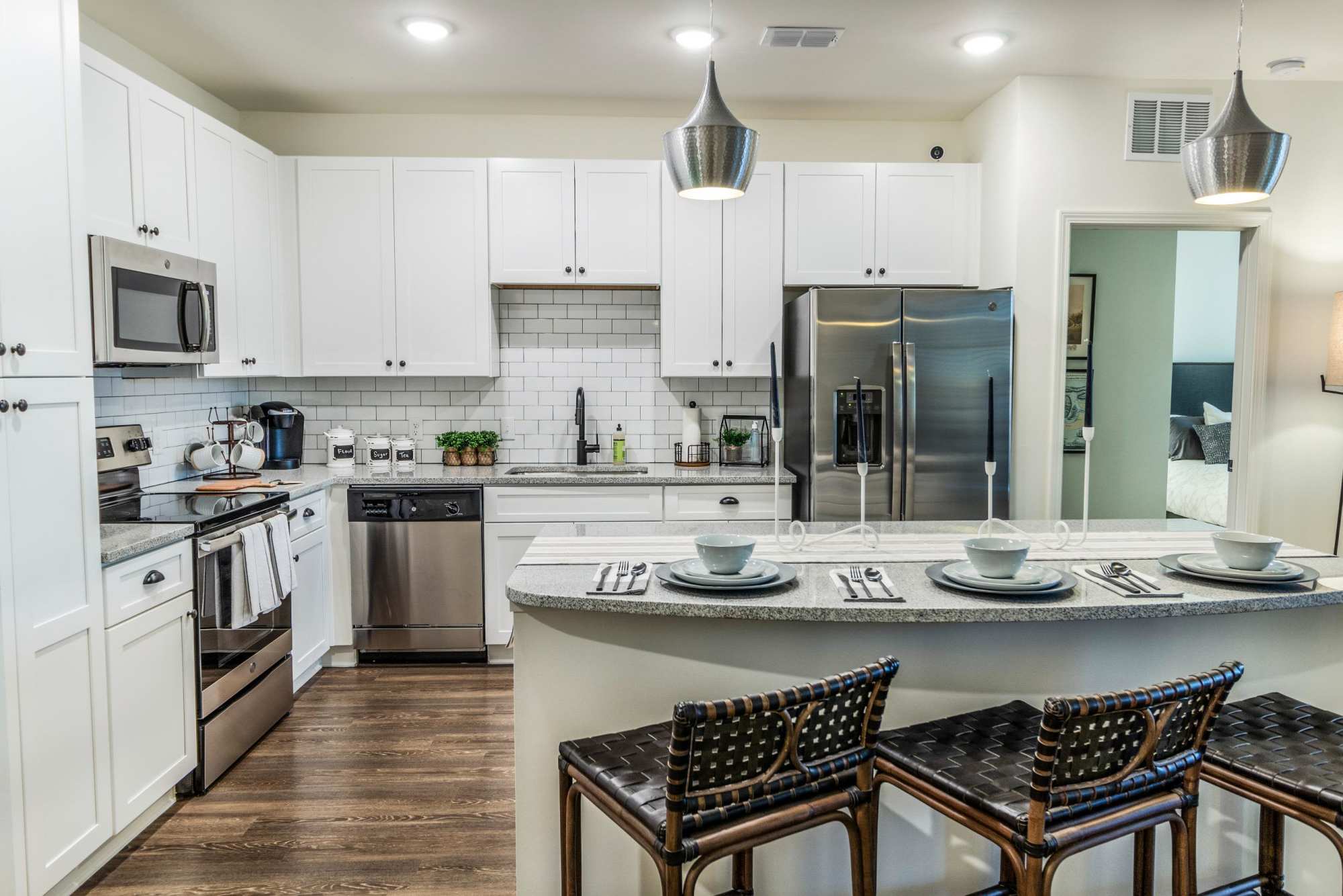 Spacious kitchen with stainless steel appliances and breakfast bar at Brisa at St. Augustine in St. Augustine, Florida