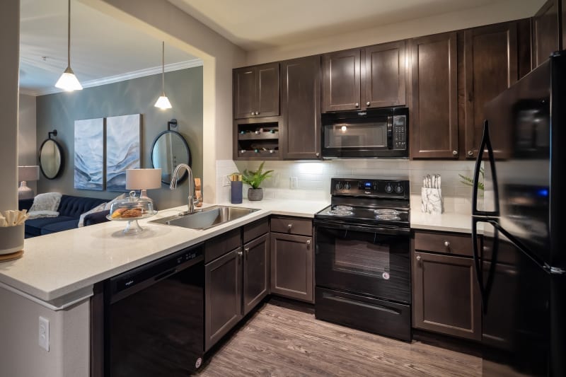 Kitchen overlooking living room at The Retreat at Cinco Ranch in Katy, Texas