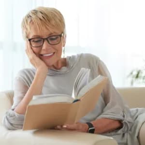 Woman reading at King City Senior Village in King City, Oregon