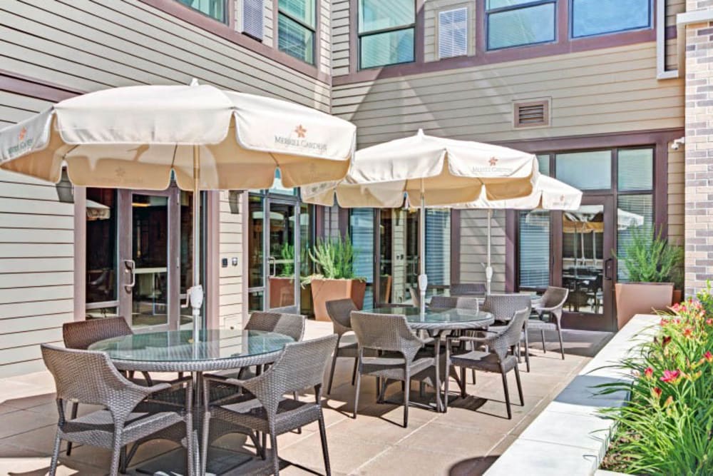 Patio with umbrellas at Merrill Gardens at Lafayette in Lafayette, California. 