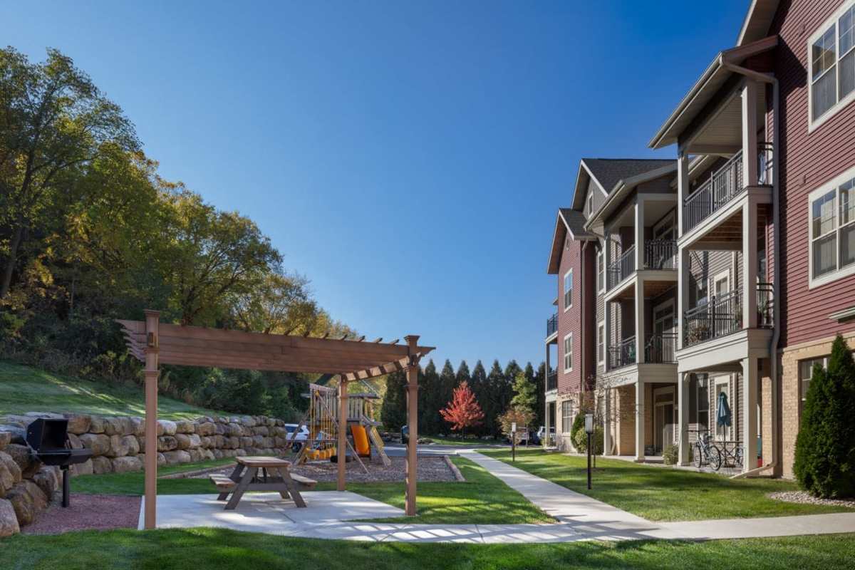 Grilling and picnic area at Mill Creek Apartments in Cross Plains, Wisconsin
