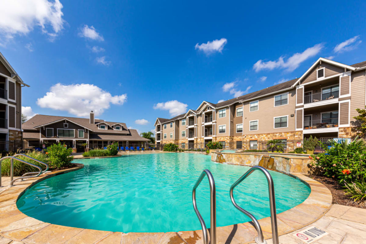 Resort-style swimming pool at Marquis at Katy in Katy, Texas