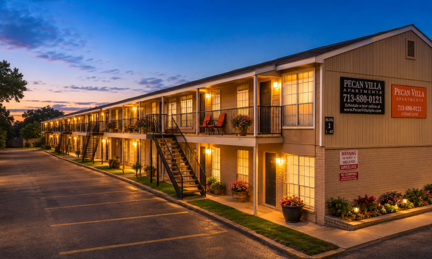 Exterior building at night of Pecan Villa Apartments in Houston, Texas