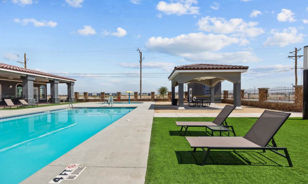 Lounge chair near pool at District At Pellicano in El Paso, Texas