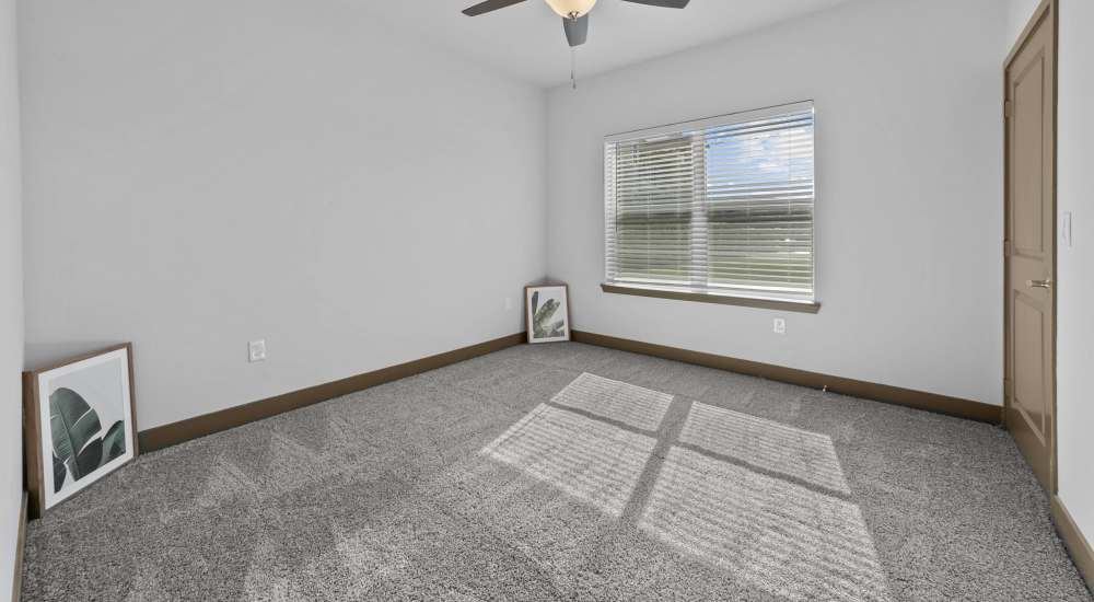 Unfurnished bedroom with window at Harvest Creek in Marshall, Texas