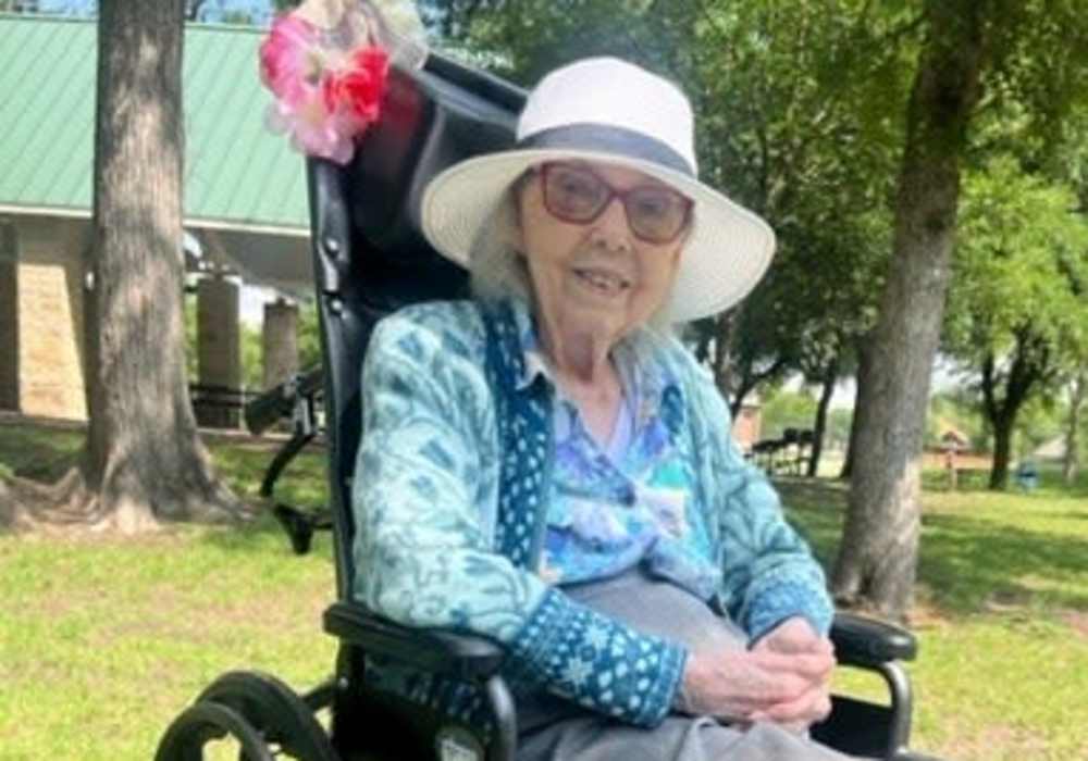 Resident posing outside at Truewood by Merrill, Keller in Keller, Texas