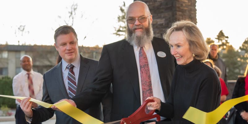 Management cutting at ribbon at Careage.