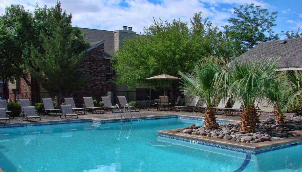 Aerial view of The Chimneys Apartments's gated community swimming pool in El Paso, Texas