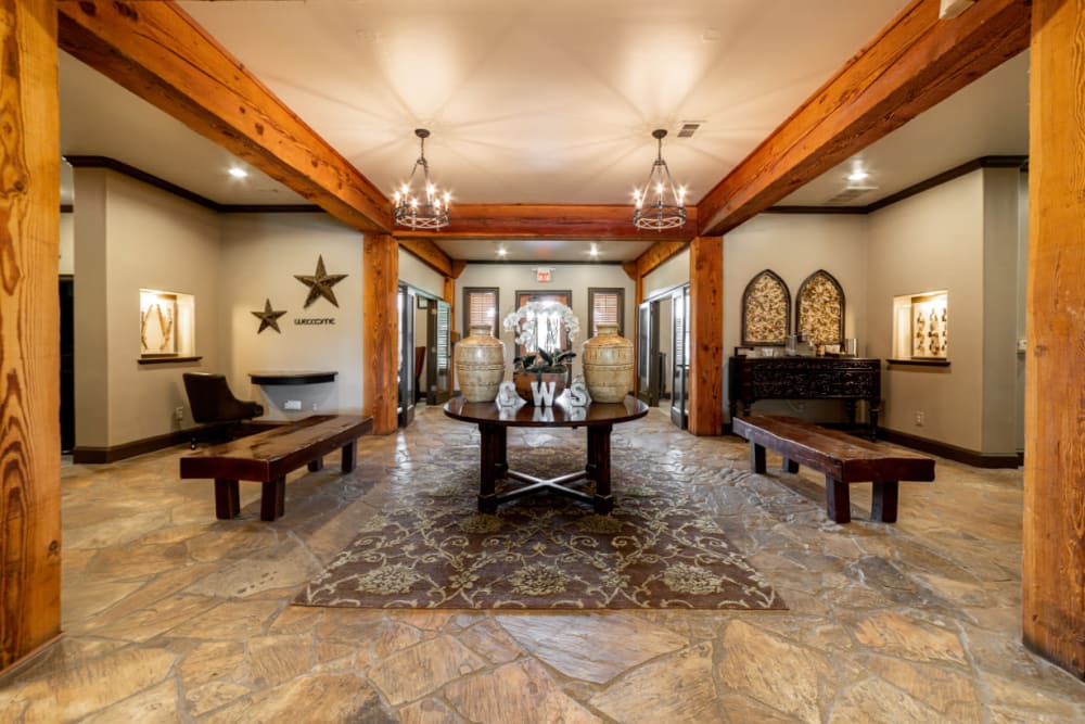 Rustic lobby entrance with benches at Marquis at Bellaire Ranch in Fort Worth, Texas