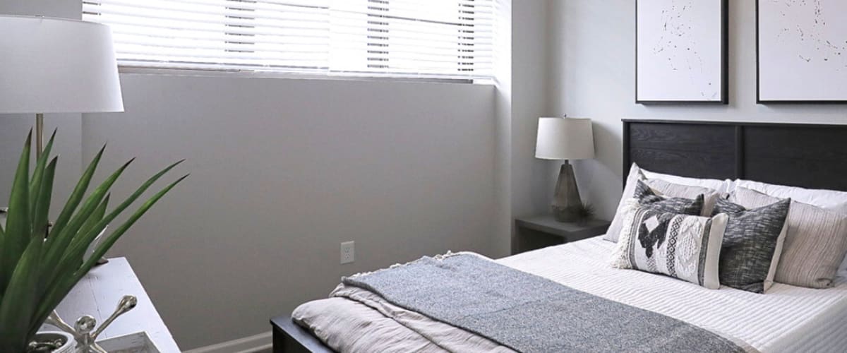 Modern bedroom at The Gateway Apartments in Mobile, Alabama
