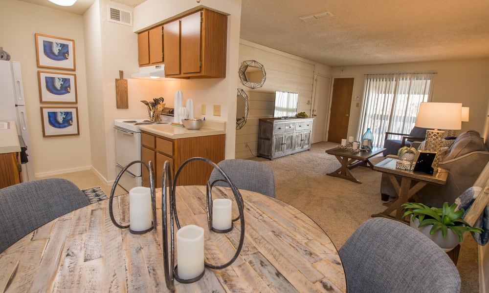 Bright and open living room and dining table at Sunchase Apartments in Tulsa, Oklahoma