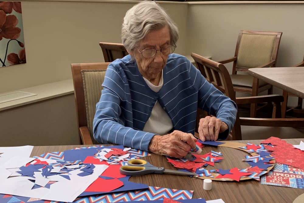 Resident making her own wreath at Brown Deer Place in Coralville, Iowa