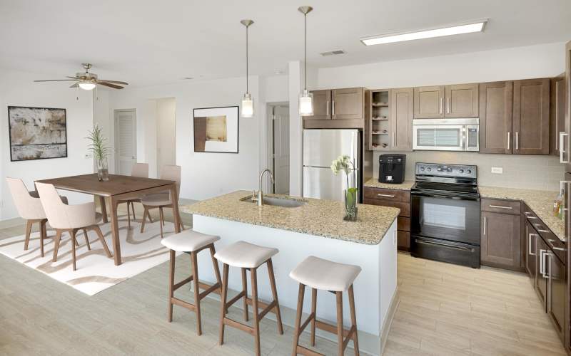 Renovated kitchen with light cabinets at Helios in Englewood, Colorado