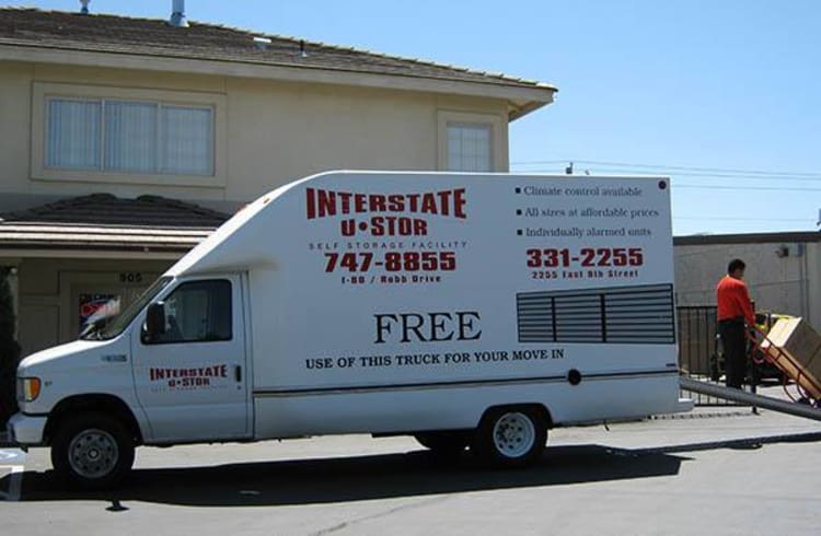 Interstate U-Stor employee unloading moving van