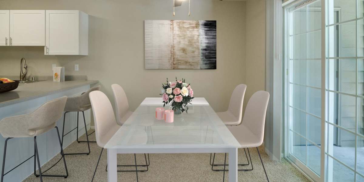 Dining room with a ceiling fan at Carriage House Apartments in Vancouver, Washington
