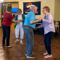 Happy seniors enjoying activities at Eastern Star Masonic Retirement Campus in Denver, CO