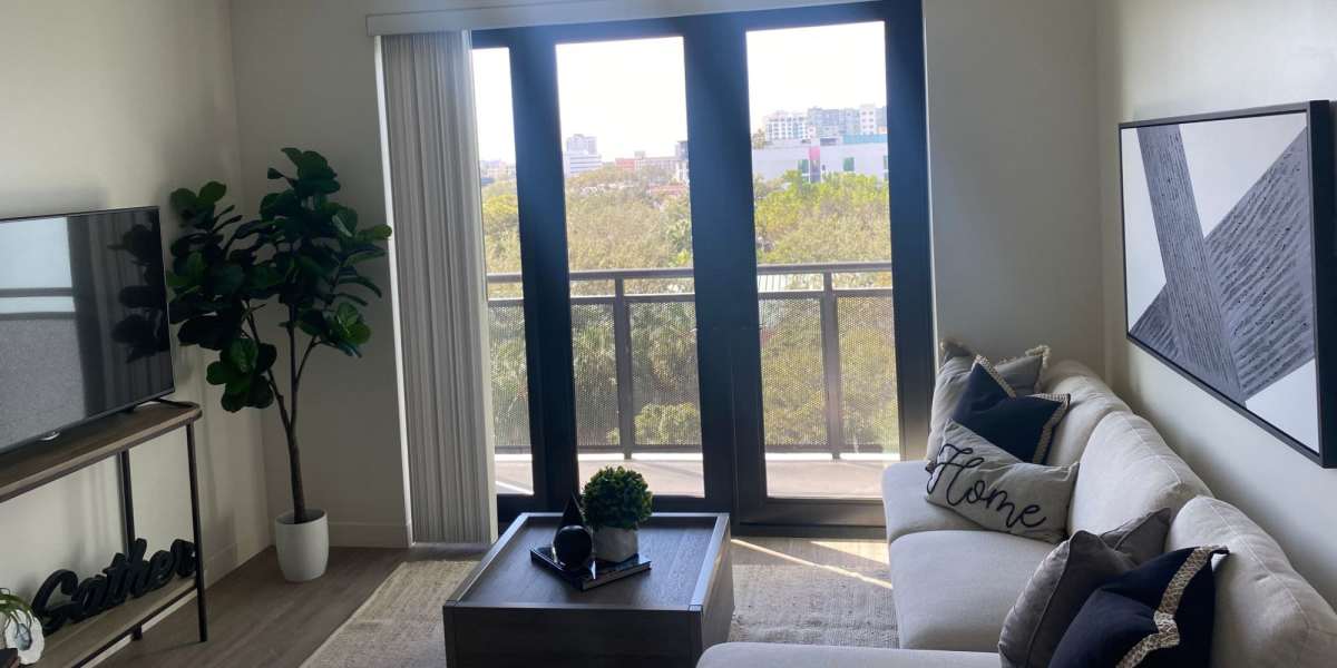 Two residents looking at a tablet at Lofts on Lemon in Sarasota, Florida