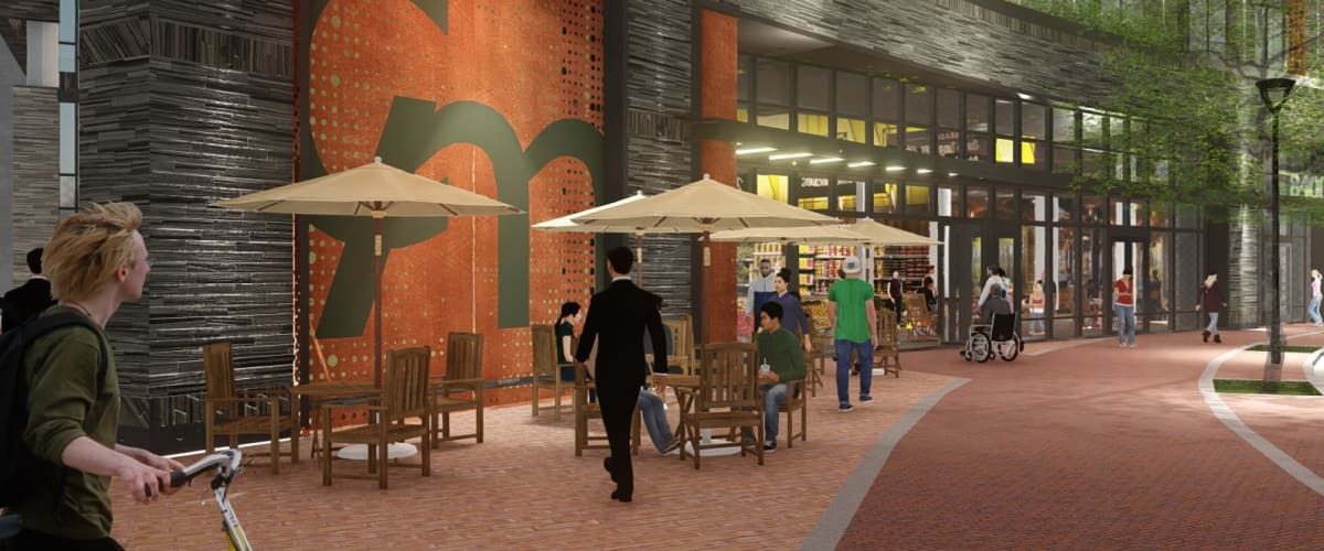 Bustling sidewalk with patio tables and umbrellas outside Solaire 8200 Dixon in Silver Spring, Maryland