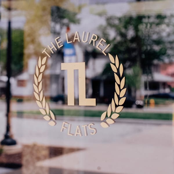 Screen printed signage on a window at The Laurel Flats in Crawfordsville, Indiana