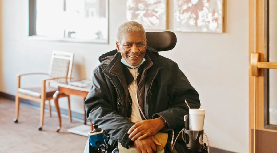 Black and white photo of a smiling resident at Peoples Senior Living in Tacoma, Washington