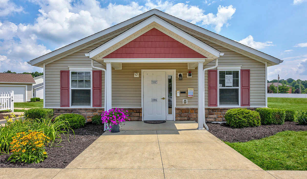 Front entrance with flowers and shrubs at Orchard Glen in Orrville, Ohio