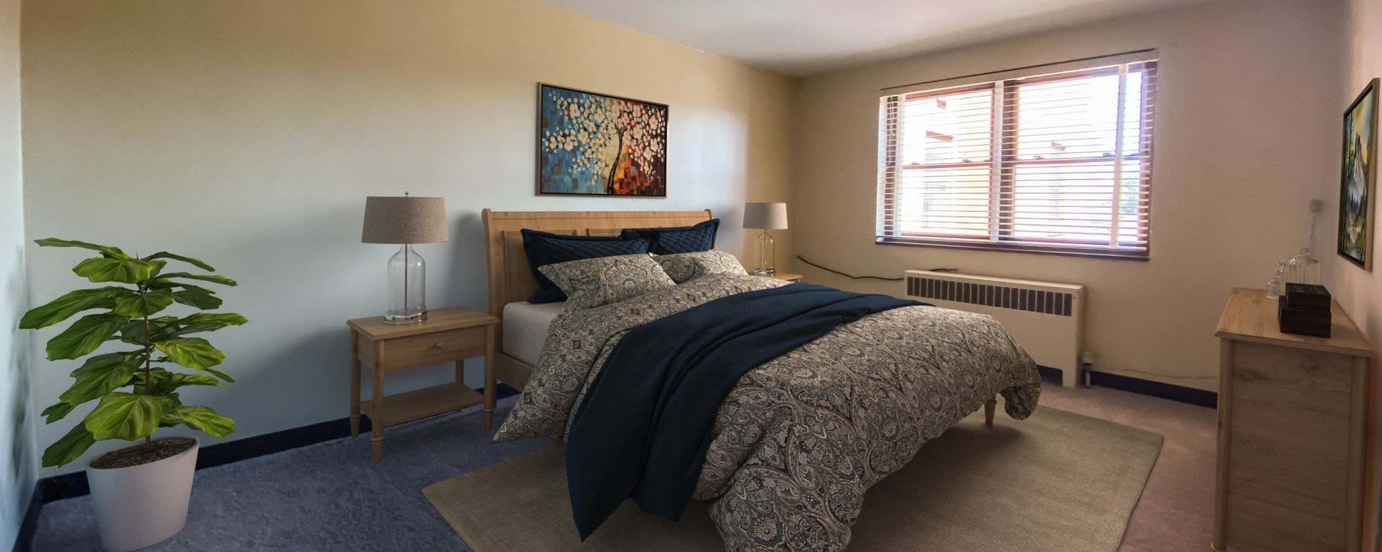 Cozy bedroom with night stand at Lebanon Vue in Pittsburgh, Pennsylvania