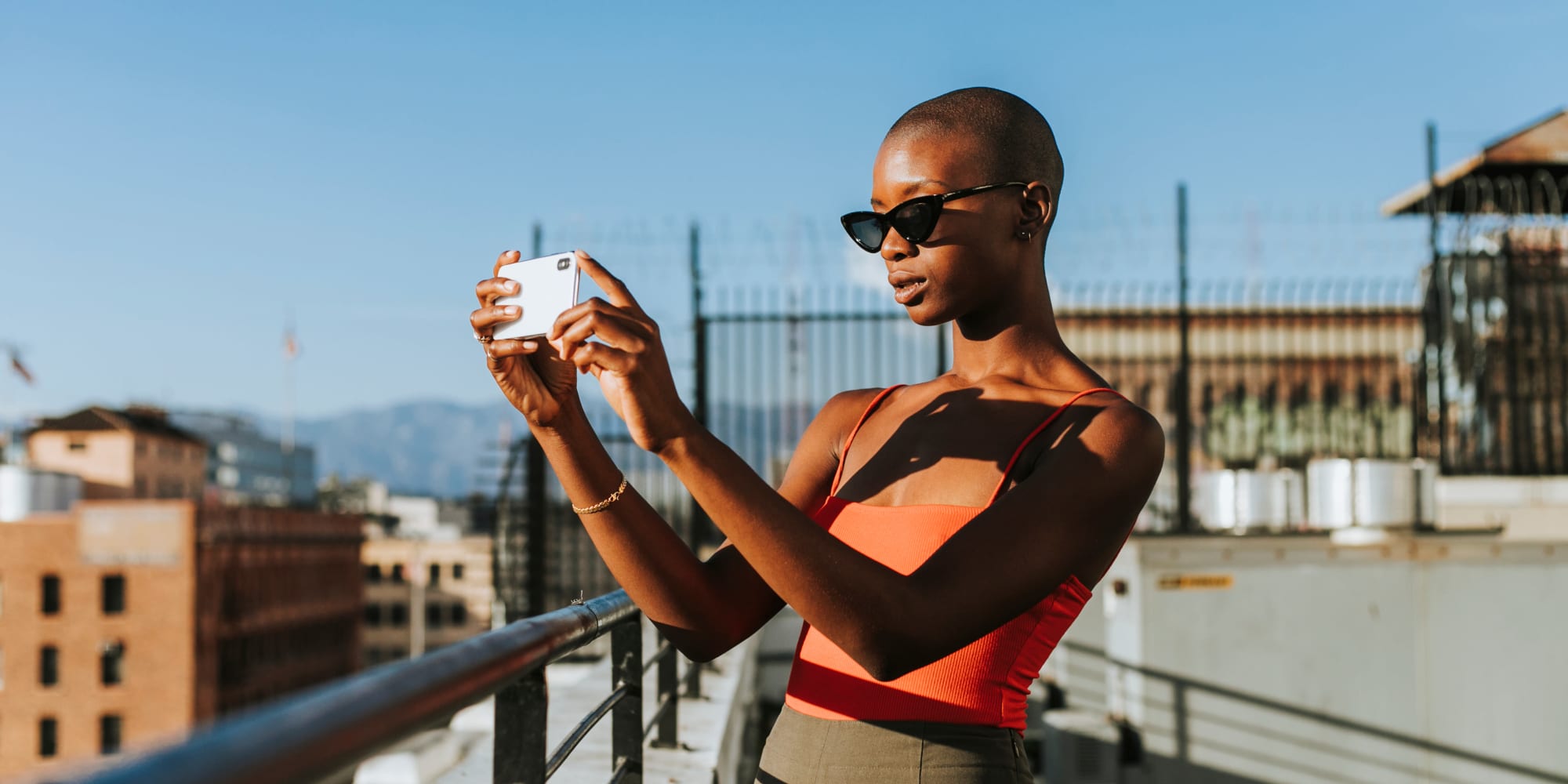 Resident taking a photo at Angelene Apartments in West Hollywood, California