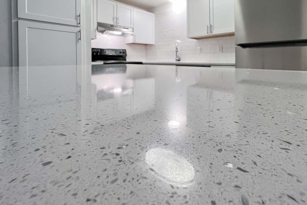 Kitchen with quartz countertop at Quail Run in Oklahoma City, Oklahoma 