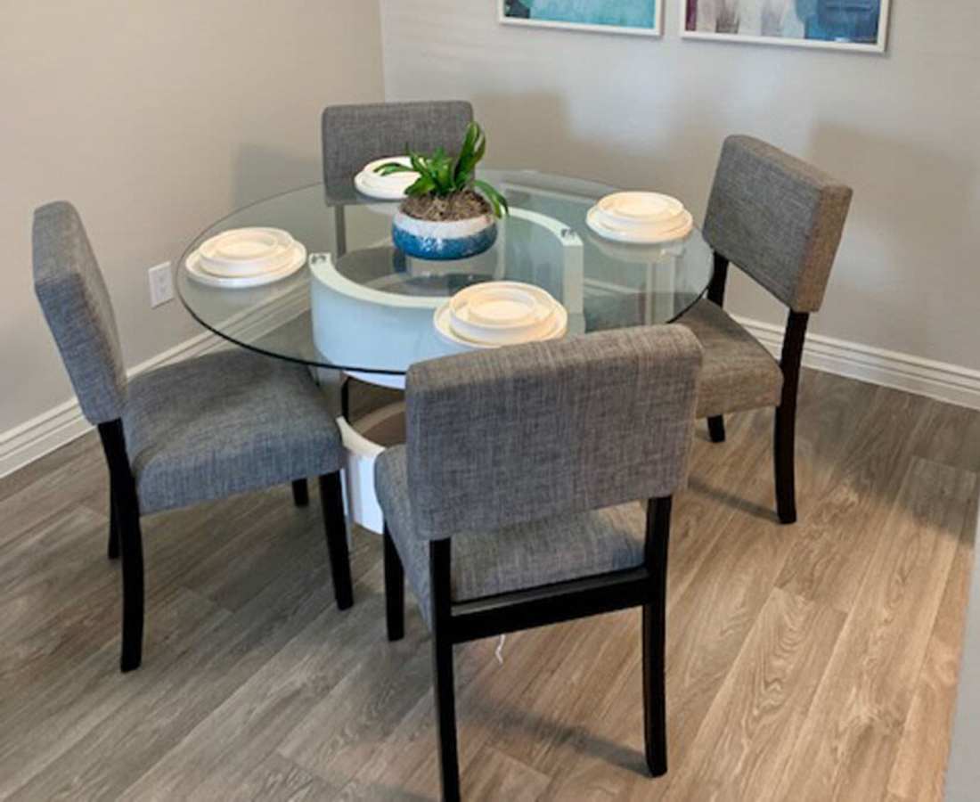 Dining area with woos-style flooring at 544 Southern Apartments in Mesa, Arizona