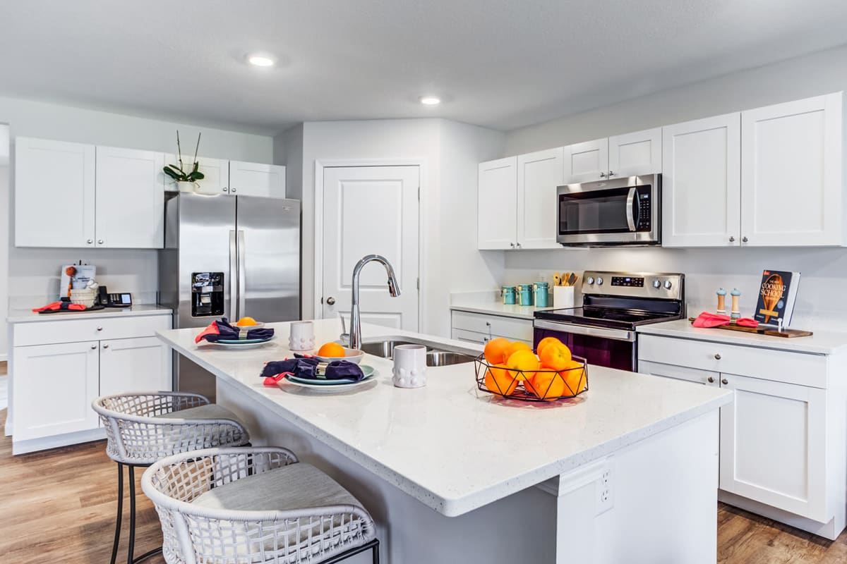 Kitchen with stainless-steel appliances at Lakes at Heather Ridge in Fort Wayne, Indiana