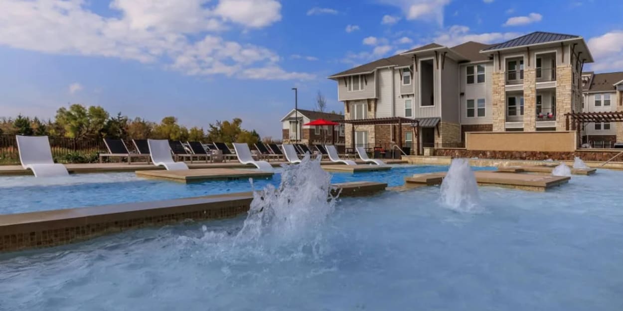 Swimming pool with fountains at Luxia Rockwall Downes, Rockwall, Texas