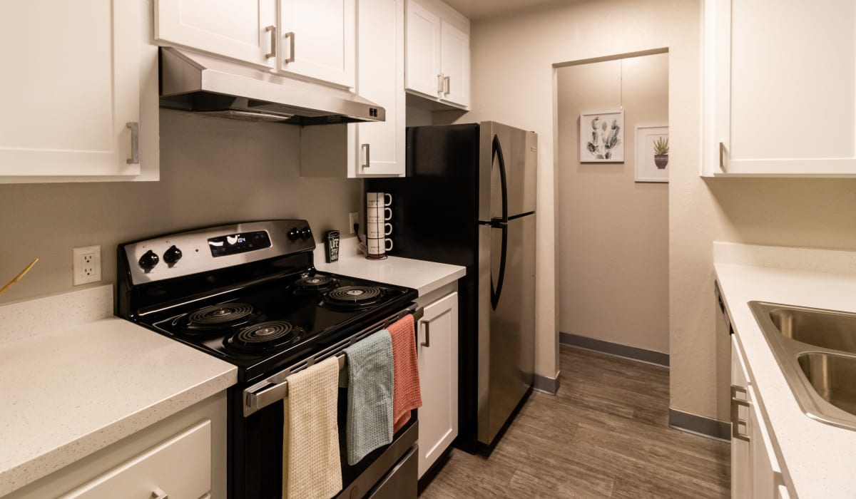 Kitchen with stainless-steel appliances at Keyway Apartments in Sparks, Nevada