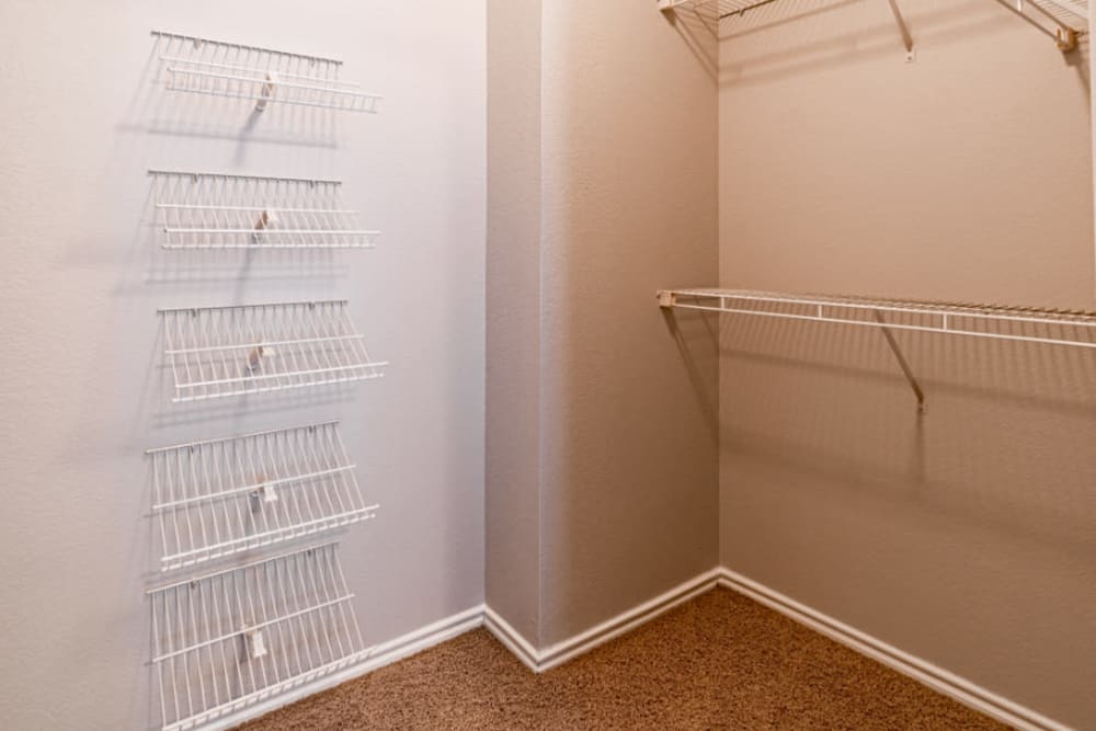 Walk-in closet with closet organizers at Marquis at Lantana in Flower Mound, Texas