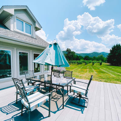 Wooden deck with seating and beautiful valley views at an English Meadows campus